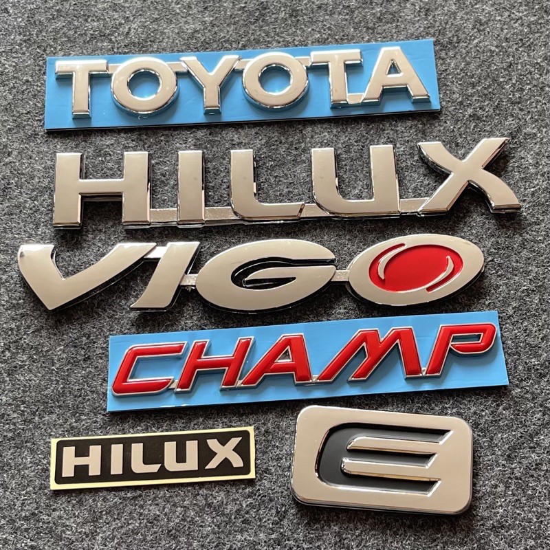 โลโก้ TOYOTA HILUX VIGO CHAMP E สติ๊กเกอร์ HILUX สีโครเมี่ยม ตัวหนังสือฝาท้าย (จำนวน 6 ชิ้น)