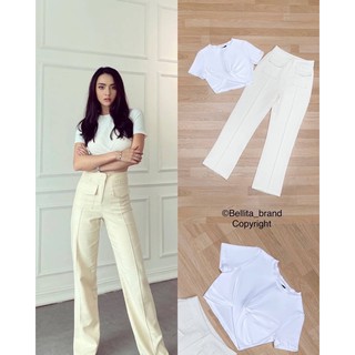 ป้าย Bellita  Detail :  เซ็ตเสื้อไขว้จีบสีขาว มาพร้อมกางเกงขากระบอกสีครีมสุดฮิตต  รุ่นนี้ขายดีมาก แนะนำเลยน้า