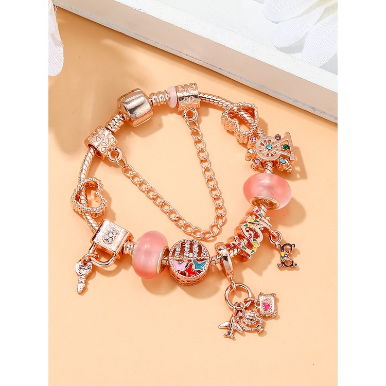 Dinglly โรสโกลด์ เครื่องบิน และกระเป๋าเดินทาง จี้ผีเสื้อ รัก ลูกปัด หัวใจ ล็อค & พวงกุญแจ จี้ สร้อยข้อมือ สําหรับผู้หญิง กําไลข้อมือคริสตัล สีชมพู