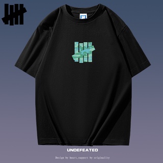 [S-5XL] Undefeated เสื้อยืดคอกลม แขนสั้น พิมพ์ลายพราง สีเขียวทหาร ทรงหลวม สําหรับผู้ชาย และผู้หญิง