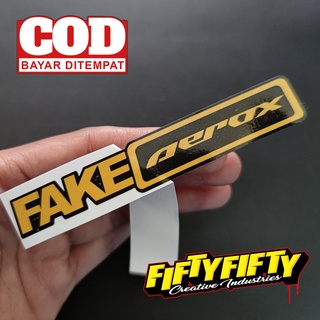 สติกเกอร์ พิมพ์ลาย FAKE AEROX กันน้ํา สําหรับติดตกแต่งหมวกกันน็อค รถจักรยานยนต์ รถยนต์