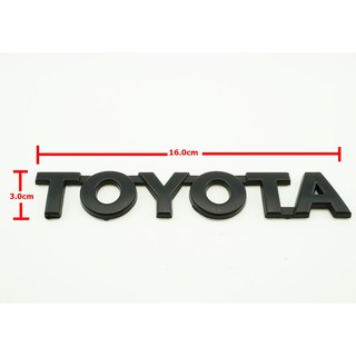 ป้ายโลโก้ Toyota พลาสติกสีดำ ขนาด 3.0x16.0cm ติดตั้งด้วยเทปกาวสองหน้าด้านหลัง