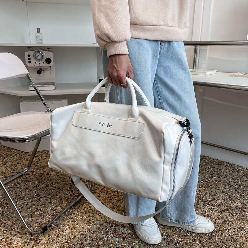 🔥ส่งเร็ว กระเป๋าหนังpuกันน้ำสวยมาก สำหรับเดินทางขนาดใหญ่ มีช่องใส่รองเท้าโดยเฉพาะ สะพายเข้ายิมเท่ๆ - รูปที่ 5