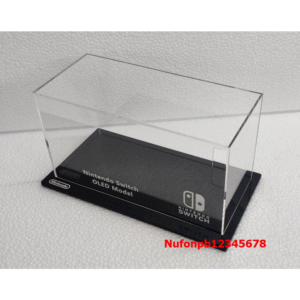 NintendoSwitch OLED กล่องอครีลิคใส สำหรับ ครอบกันฝุ่น แบบเจาะรูหลัง มีฐานสีดำ