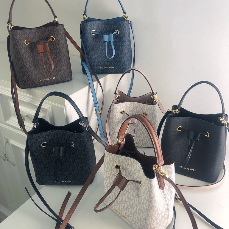 mk กระเป๋าถัง super cute mini bucket bag hand-helder one-shoulder messenger new color matching old flower dra