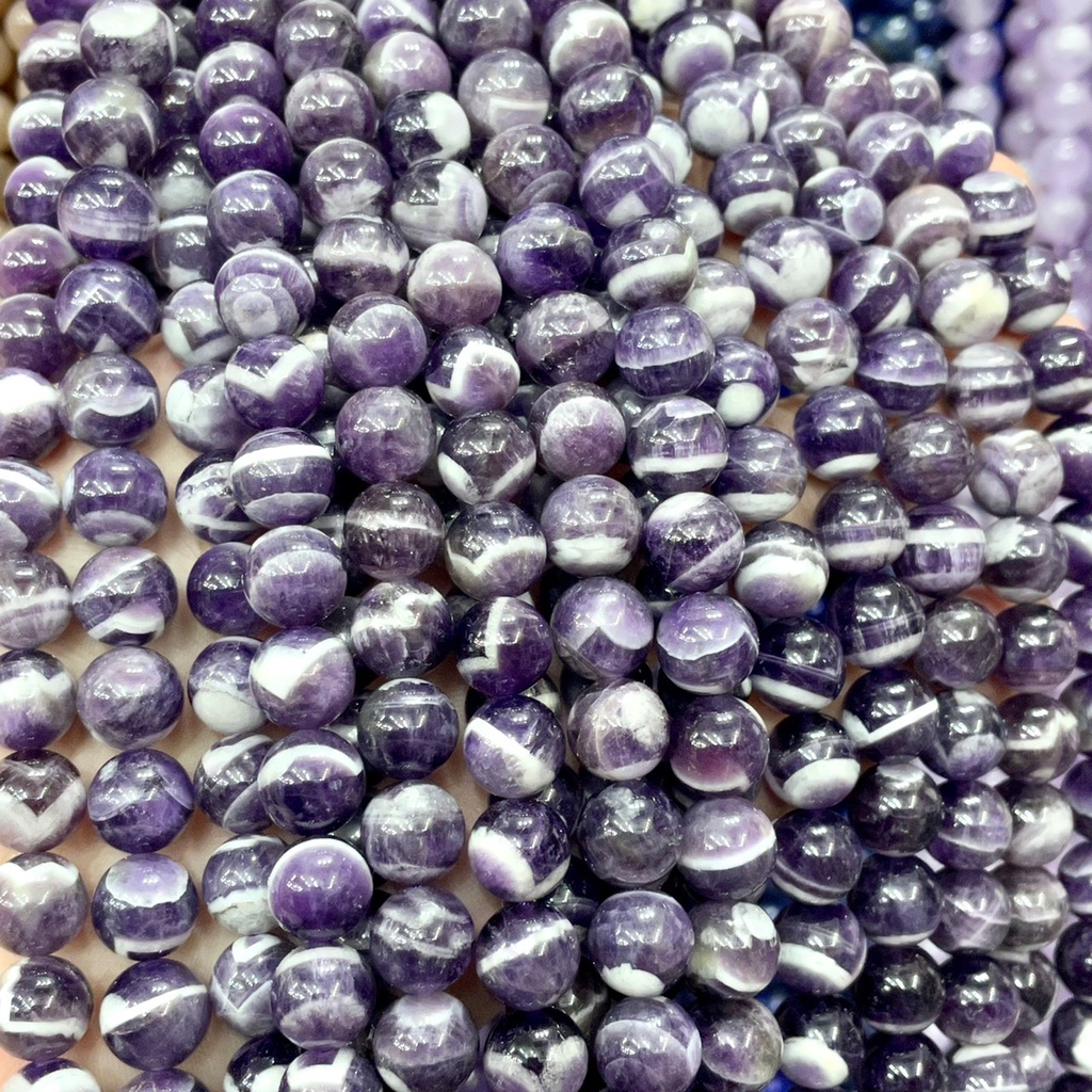 พลอย เชฟร่อน อเมทิสต์ Chevron Amethyst หินแห่งวิสัยทัศน์ ทรงกลม เส้นยาว เกรด AAA