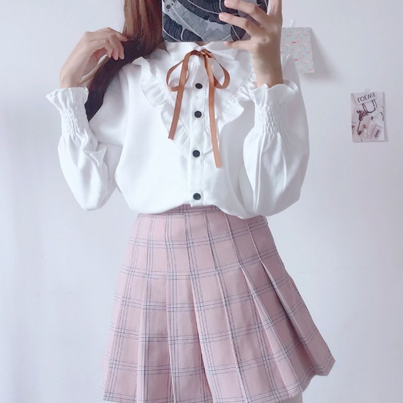 miss.th เสื้อสีขาวผู้หญิงขอบใบบัวผูกโบว์ น่ารัก เสื้อเชิ้ตแขนยาวผูกเชือกเกาหลี