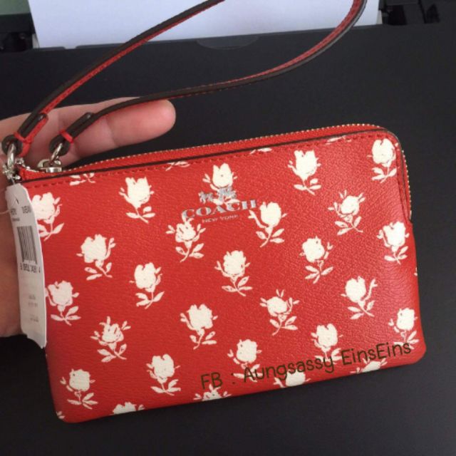 ✔#SALE COACH Small Wristlet คล้องมือ #F65761 
สีส้มลายดอกไม้ขาว
