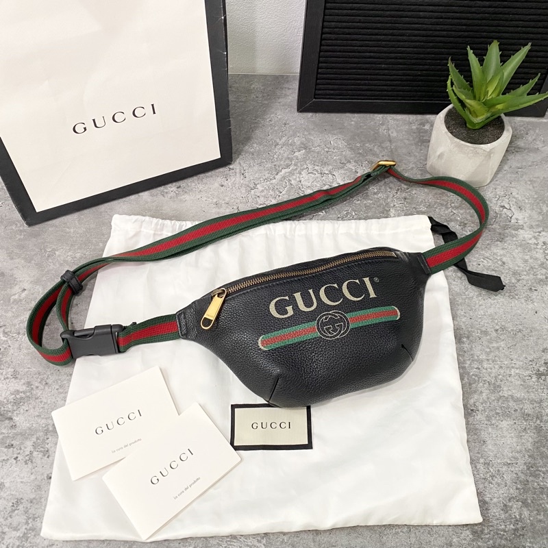 Gucci print leather mini belt bag