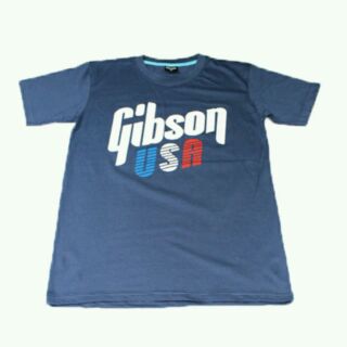 เสื้อยืดคอกลมสีเทาอากาศ screen ว่า "Gibson USA"