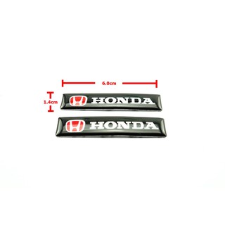 2ชิ้นป้ายโลโก้เลซิ่น HONDA พื้นดำตัวหนังสือขาวขนาด 6.0x1.4cm ติดตั้งด้วยเทปกาวสองหน้าด้านหลัง