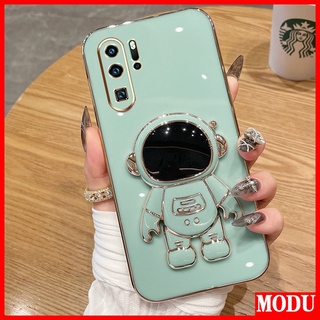 Modu เคสโทรศัพท์มือถือชุบไฟฟ้า ลายนักบินอวกาศ หรูหรา พร้อมขาตั้ง สีมาการอง สําหรับ Huawei P30 Pro P40 Pro P50 Pro P30 Lite