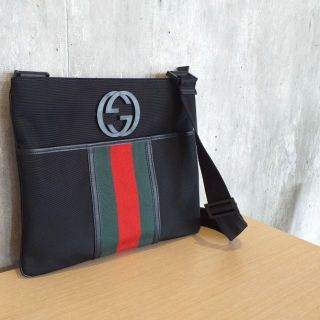 GUCCI
Interlocking Black Nylon Web Messenger