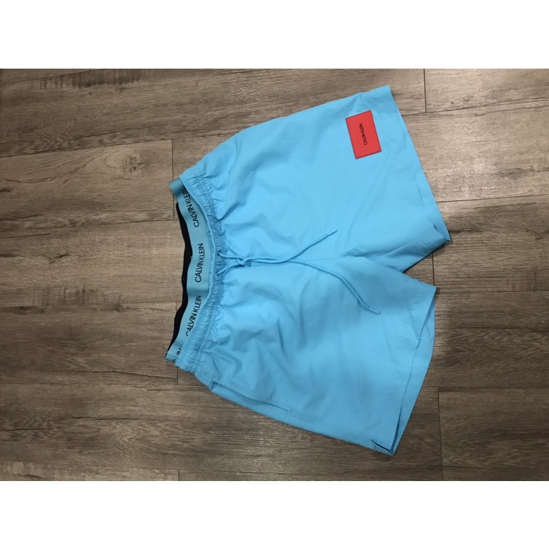 กางเกงว่ายน้ำCK สีฟ้าโลโก้แดง :  Calvin Klein swim shorts [KM0KM00308]