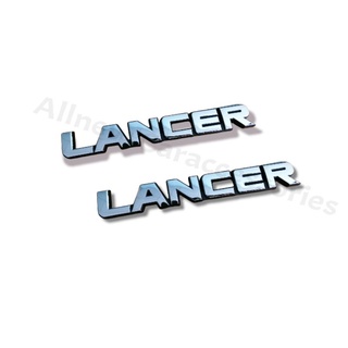 โลโก้ LANCER ขอบดำ ขนาด 2*14.3 cm. ราคาต่อ 1ชิ้น