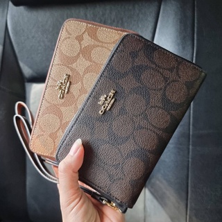 กระเป๋าสตางค์ COACH F57468 PHONE WALLET IN SIGNATURE COATED CANVAS