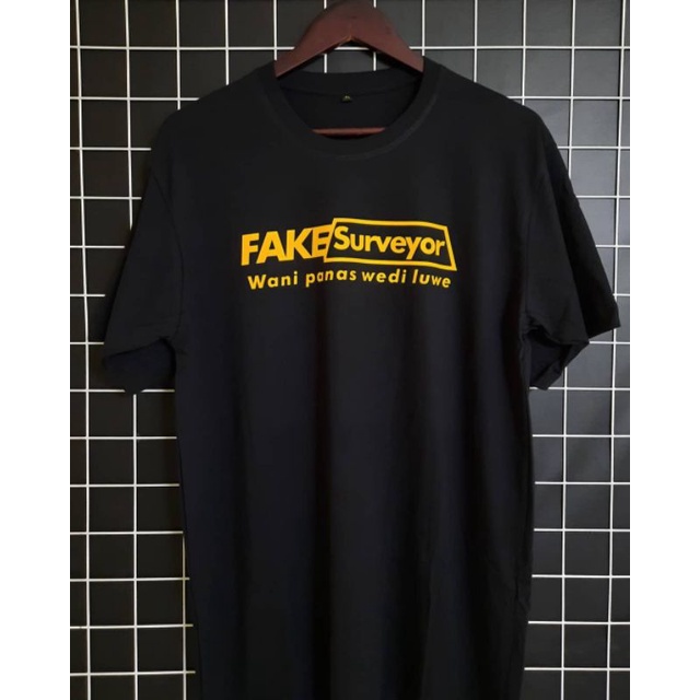 เสื้อยืด FAKE SURVEYOR WANI HOT WEDI LUWE / เสื้อยืด SURVEYOR