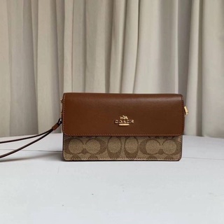 COACH  FOLDOVER WRISTLET IN SIGNATURE CANVAS