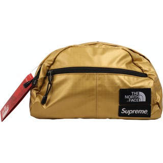 PROSPER - Supreme X The North Face Metallic Roo II Lumbar Pack Gold