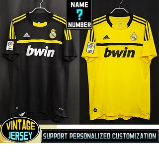 เสื้อกีฬาแขนสั้น ลายทีมชาติฟุตบอล Real Madrid 2011-12 Real Madrid สีดํา และสีเหลือง สไตล์วินเทจ ไซซ์ s-2xl