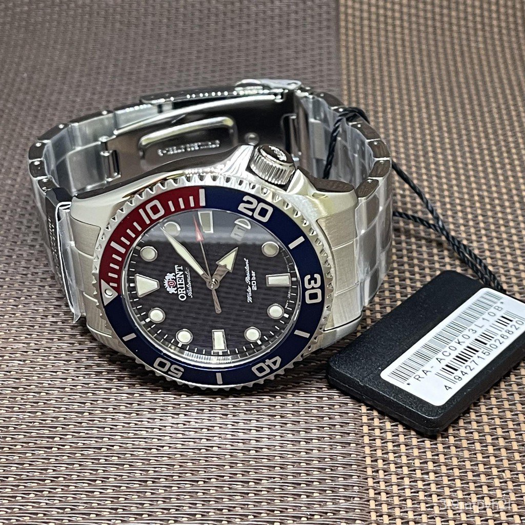 Orient Triton - Orologio da polso da uomo automatico e a carica manuale meccanico casual bracciale e cassa in acciaio inox di colore grigio display analogico verde - RA-AC0K02E10B