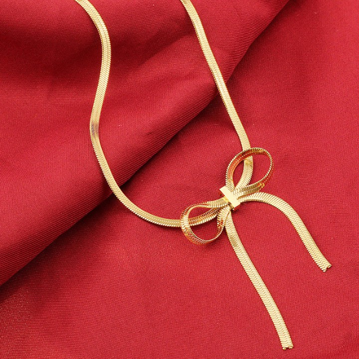 สร้อยคอก๋วยเตี๋ยวแบนไทเทเนียมของผู้หญิงผูกโบว์ที่สวยงาม WDC740