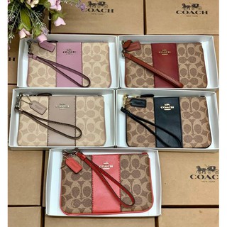 กระเป๋าถือ SMALL WRISTLET IN COLORBLOCK SIGNATURE ((32445))