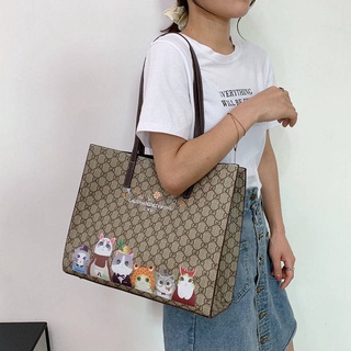 กระเป๋าสะพายข้าง กระเป๋าแฟชั่น กระเป๋าผู้หญิงความจุสูง2021 New Fashion niche Graffiti Printing Tote Bag ทำงานเดินทางกระเ