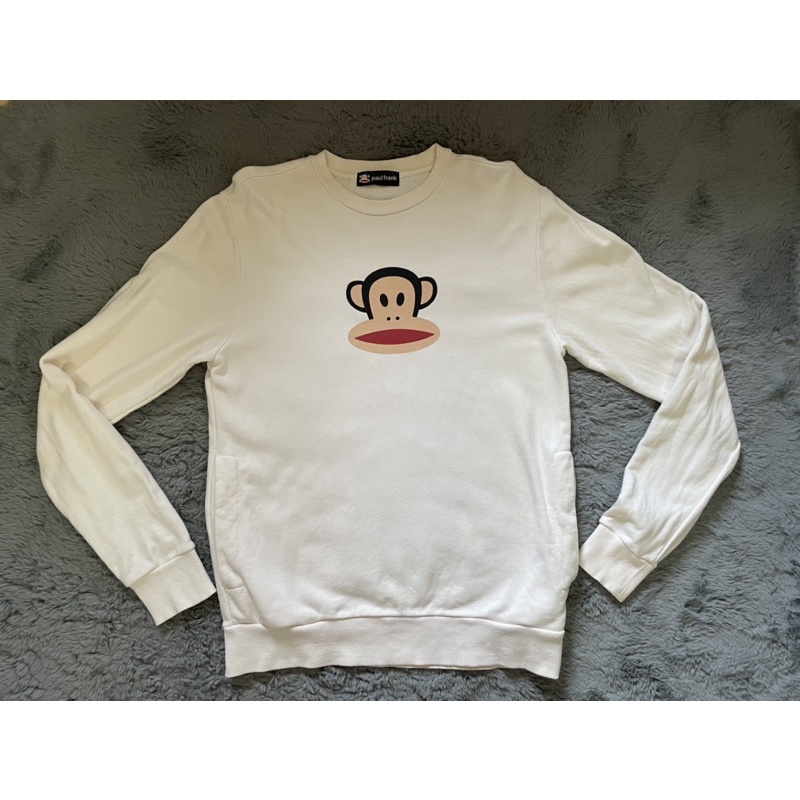 เสื้องาน Paul frank เสื้อหนาว  แขนยาว สีขาวออกครีม ผ้าไม่หนามาก มีกระเป๋าสองข้าง รายละเอียดตำหนิรอยเ