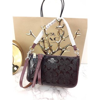 COACH TOP HANDLE POUCH IN SIGNATURE DEBOSSED PATENT LEATHER