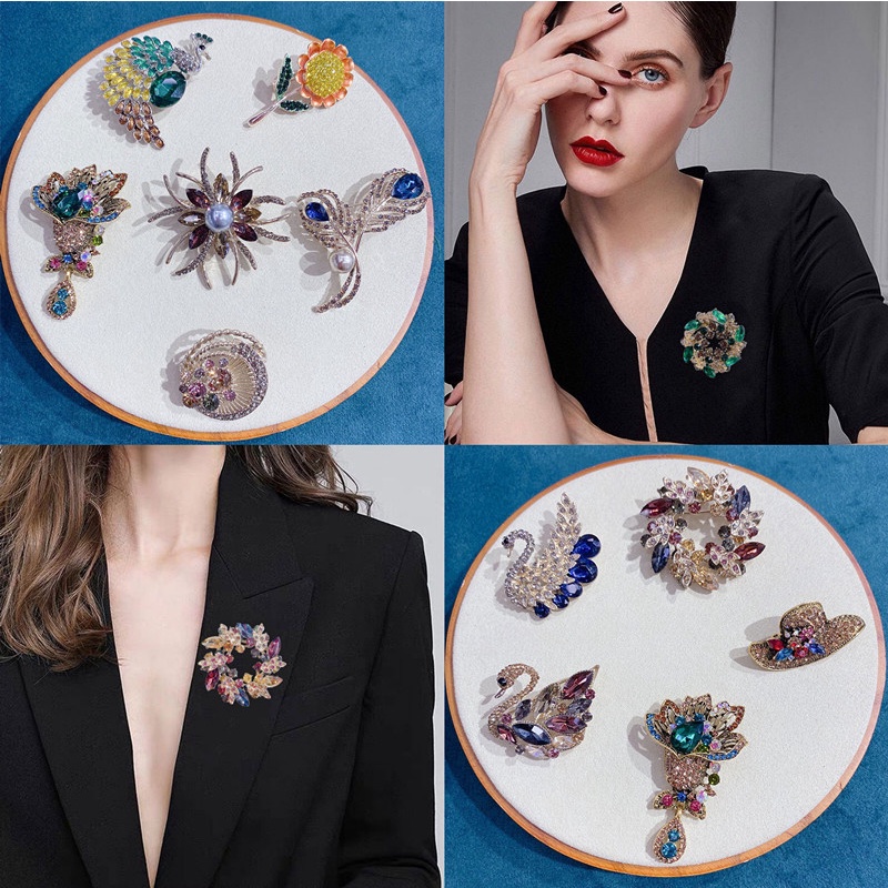 พวงมาลัยดอกไม้ระดับไฮเอนด์หงส์เข็มกลัดย้อนยุครอบนกยูงมุกขนนกเข็มกลัดเครื่องประดับแฟชั่น