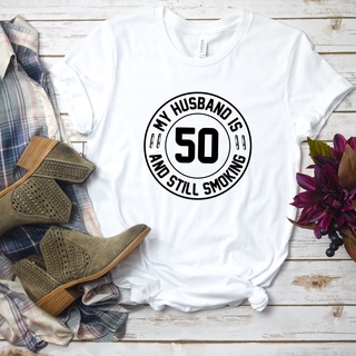 T-shirt  เสื้อยืด พิมพ์ลาย My Husband Is 50 and Still Smoking ของขวัญวันเกิดครบรอบ 50 ปี สามี 50 ปีS-5XL