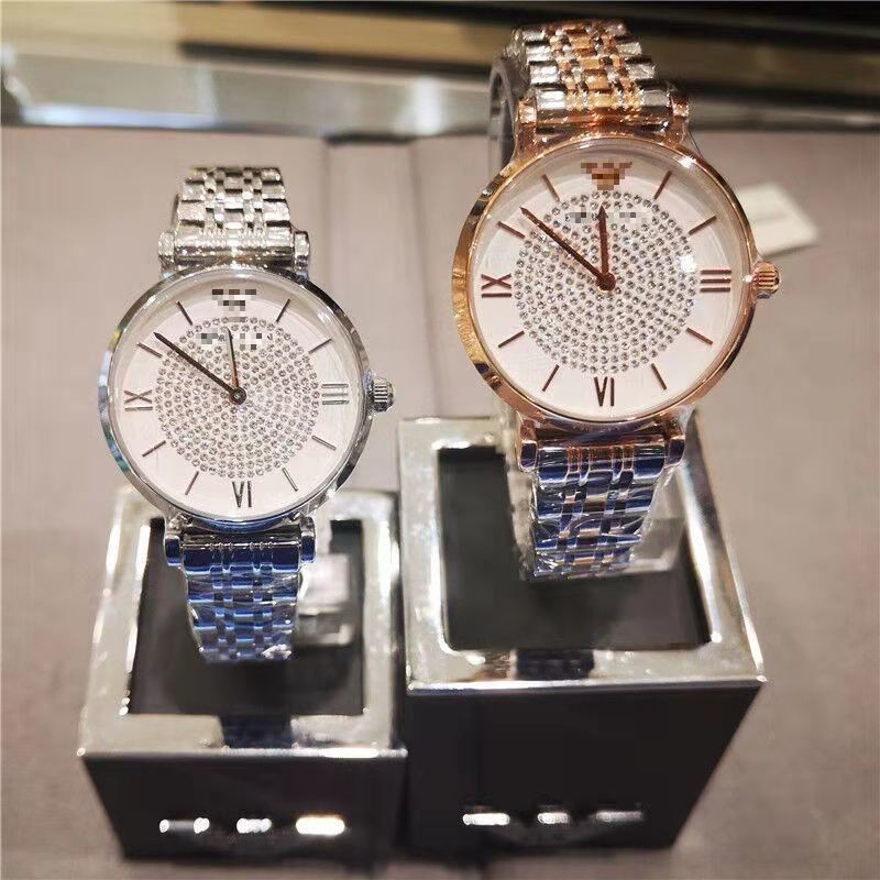 Casio นาฬิกาข้อมือคู่ ┋♙ใหม่แท้ Armani starry แฟชั่นคู่นาฬิกาควอตซ์เหล็กเข็มขัดเพชรผู้ชายและผู้หญิงนาฬิกาชิงช้าสวรรค์
