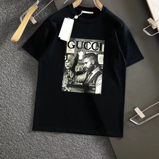 เสื้อยืดแขนสั้น ทรงหลวม พิมพ์ลายตัวอักษร Gucci แฟชั่นฤดูใบไม้ผลิ และฤดูร้อน สําหรับผู้ชาย และผู้หญิงเสื้อยืด