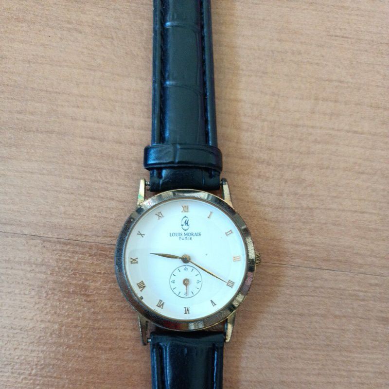 นาฬิกาแบรนด์เนม louis morais parisหน้าปัดสีขาวตัวเรือนสีทอง สายหนังสีดำของแท้มือสองสภาพใช้งานได้ปกติ