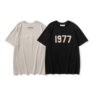 เสื้อยืดแขนสั้นลําลอง ทรงหลวม พิมพ์ลายตัวอักษร FOG 1977 แฟชั่นคู่รัก สไตล์คลาสสิก สําหรับผู้ชาย และผู้หญิง