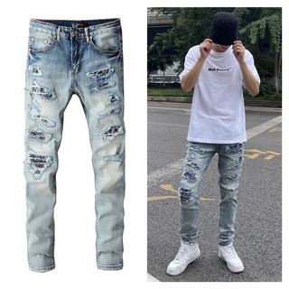 31 พร้อมส่ง ขายดี NEW AMIRI light-colored ripped patch slim jeans