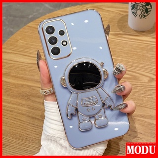 Modu เคสโทรศัพท์มือถือชุบไฟฟ้า ลายนักบินอวกาศ หรูหรา พร้อมขาตั้ง สีมาการอง สําหรับ Samsung Galaxy A24 A14 A74 A52S 5G A32 A52 A72 A23 4G 5G