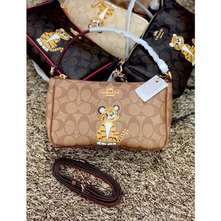 COACH TOP HANDLE POUCH SIGNATURE WITH BABY TIGER PRINT