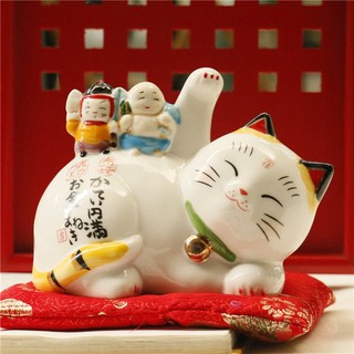 แมวกวัก แมวนำโชค แมวโชคดี lucky cat นอนกวัก