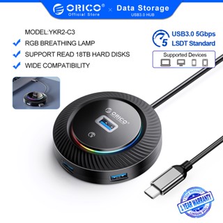 Orico ฮับ USB RGB พร้อมพอร์ตข้อมูล USB 3.0 4 พอร์ต และพอร์ตชาร์จ USB 1 พอร์ต แยก USB 5 Gbps พร้อมสายเคเบิล 0.3 0.5 1 1.8 ม. สําหรับแล็ปท็อป คอมพิวเตอร์ (YXR2)