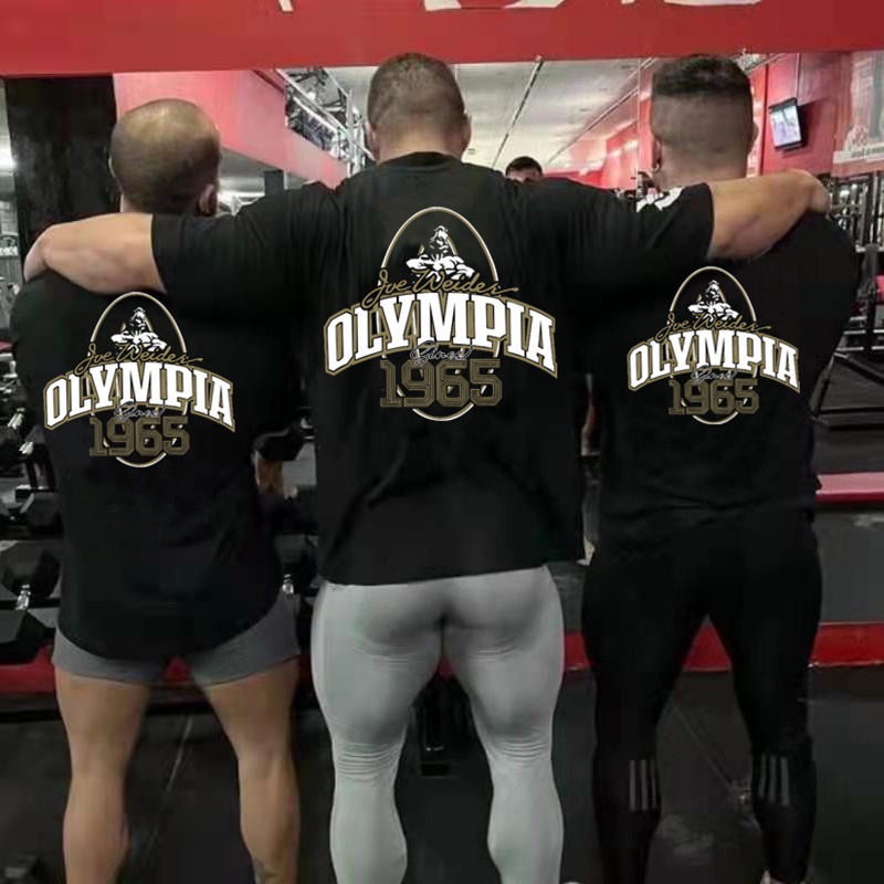 Olympia 1965 ใหม่ เสื้อยืดลําลอง ผ้าฝ้าย แขนสั้น ทรงหลวม ขนาดใหญ่ สําหรับผู้ชาย เหมาะกับการวิ่ง ออกกําลังกาย เล่นบาสเก็ตบอล ฟิตเนส ไซซ์ M-XXXL