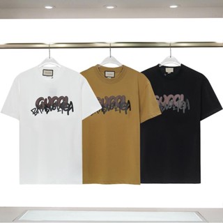 ใหม่ เสื้อยืดแขนสั้นลําลอง คอกลม ผ้าฝ้ายแท้ พิมพ์ลาย GG แฟชั่นสําหรับผู้ชาย และผู้หญิง