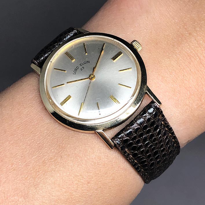 นาฬิกามือสอง LORD ELGIN 23 1970 ระบบไขลาน ขนาด 33mm หน้าปัดบรอนซ์เงินประดับหลักเวลาขีดทอง เดินเวลา 3 เข็ม กระจกเซลลูลอย