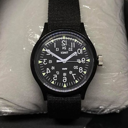 Timex TM-TWH1Y1410 นาฬิกาข้อมือผู้ชาย สายผ้าไนล่อน สีดำ (รุ่นพิเศษ ตัวเลขหน้าปัดกลับด้าน)