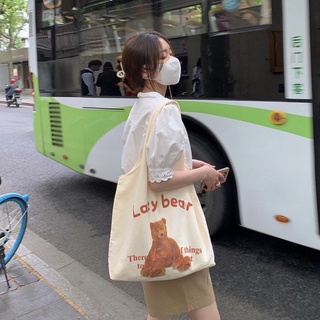 KOREA(KR1811) กระเป๋าผ้าทรงถุงช้อปปิ้ง ลายน้องหมี Lazy bear สีครีม สุดน่ารัก