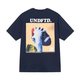 เสื้อยืดแขนสั้นลําลอง คอกลม ทรงหลวม ลายแบรนด์ undefeated สไตล์โตเกียว สําหรับผู้ชาย และผู้หญิง