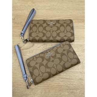 (ผ่อน0%) กระเป๋าสตางค์ Coach Long Zip Around Wallet In Signature Canvas C4452 ซิปรอบ ลายซีสีน้ำตาล ซิปสีฟ้า สายคล้องมือ