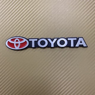 โลโก้* TOYOTA สีเงินขอบดำ งานอลูมิเนียม ขนาด* 2.8 x 16 cm ราคาต่อชิ้น