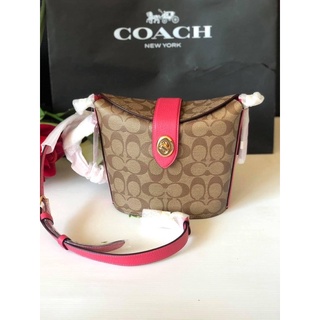 (ผ่อน0%) กระเป๋าสะพายข้าง ADDIE CROSSBODY IN SIGNATURE CANVAS (COACH C2817) ลายซีสีน้ำตาล สายสะพายสชมพู